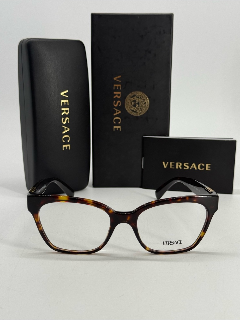 Versace Women's Tortoiseshell Cat-Eye Glasses in Brown and Amber